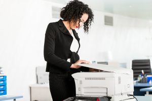 woman prepares documents for process serving