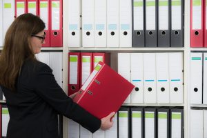 woman prepares documents for court filing