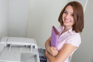 woman prepares files for legal photocopying